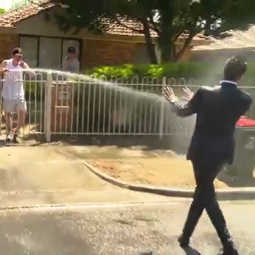 Watch 'A Current Affair' Reporter Get Completely Drenched By Family On National TV